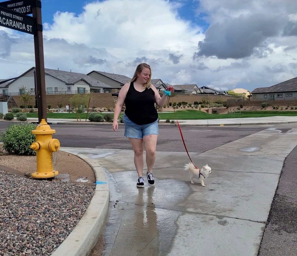 Kenna walking a dog